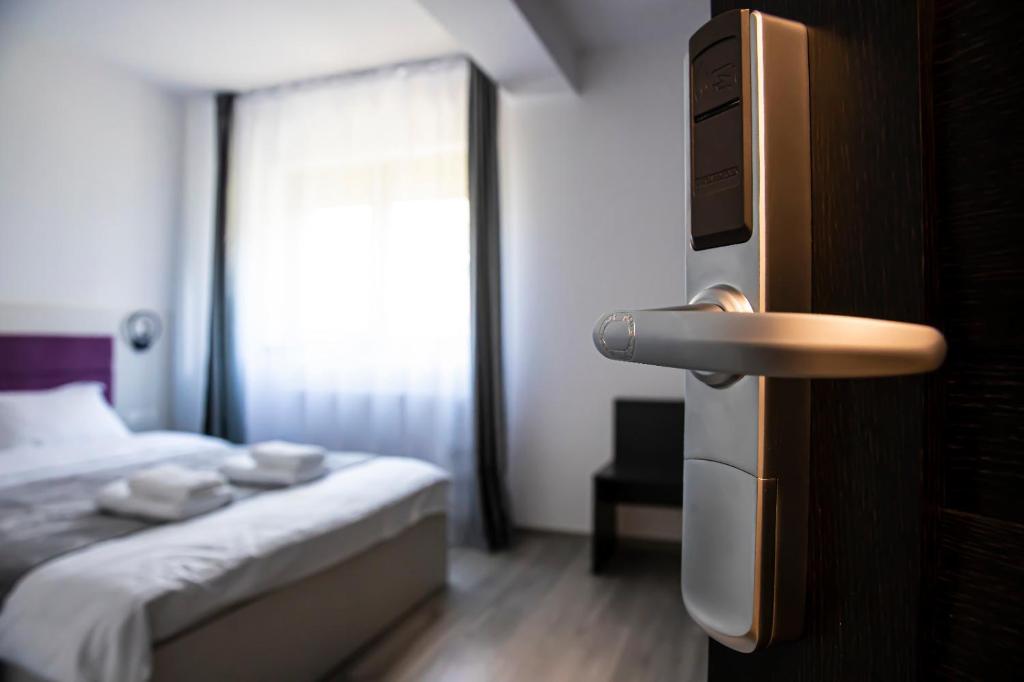Postel nebo postele na pokoji v ubytování Casa Orhideea