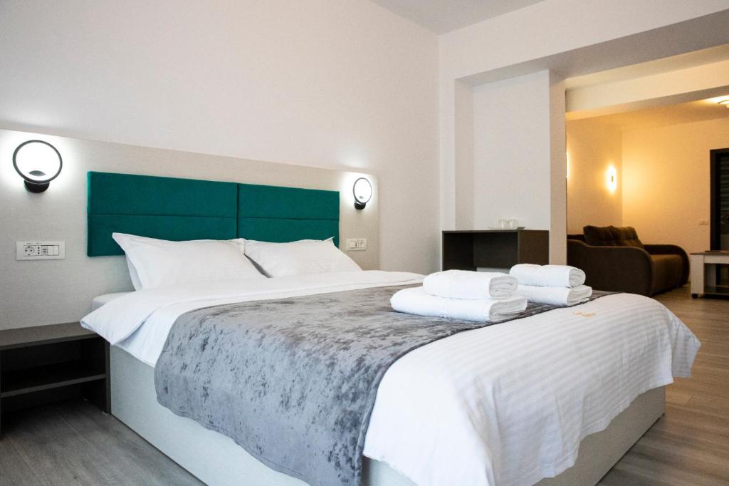 Postel nebo postele na pokoji v ubytování Casa Orhideea