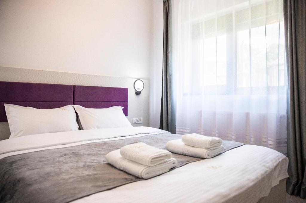 Postel nebo postele na pokoji v ubytování Casa Orhideea