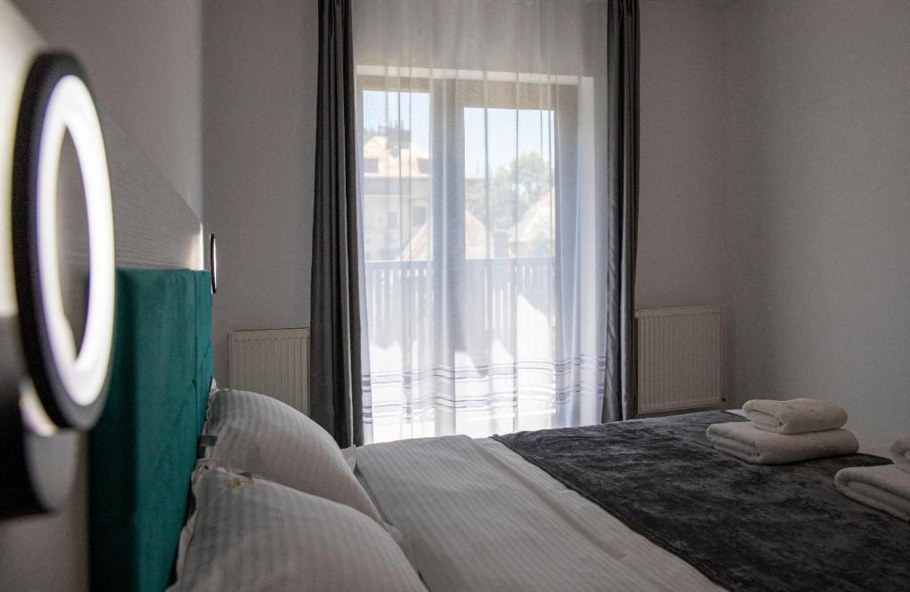 Postel nebo postele na pokoji v ubytování Casa Orhideea