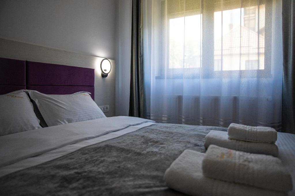 Postel nebo postele na pokoji v ubytování Casa Orhideea