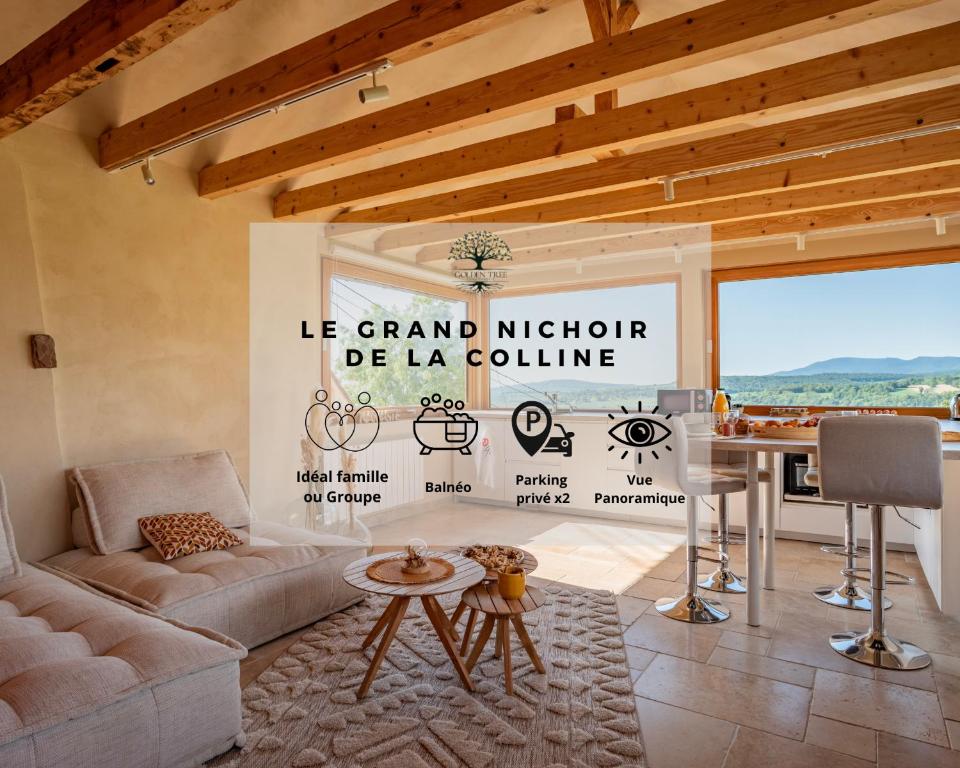 a living room with a couch and a table at Le Grand Nichoir de la Colline - Parking - Wifi in Mutzig