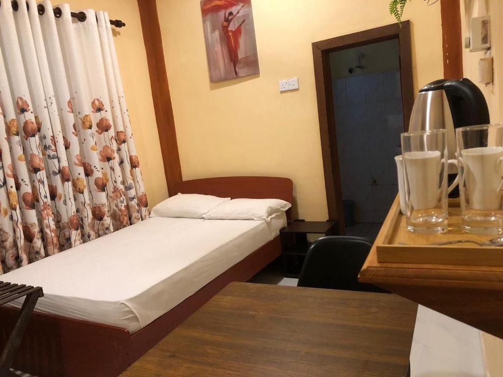 Postel nebo postele na pokoji v ubytování Cinnamon Airport Residencies
