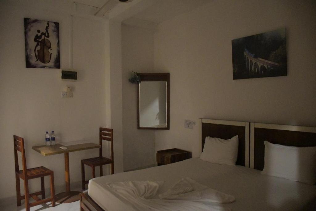 Postel nebo postele na pokoji v ubytování Cinnamon Airport Residencies