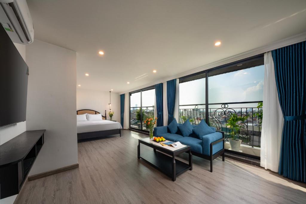 Postel nebo postele na pokoji v ubytování SQ Hang Gai hotel & Spa
