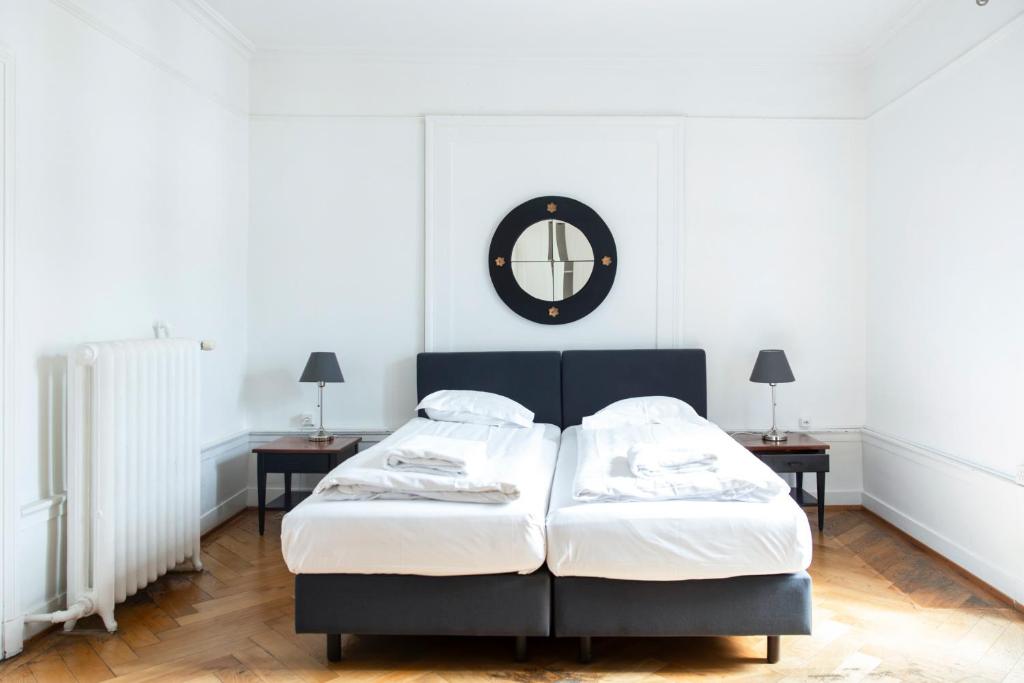 Postel nebo postele na pokoji v ubytování Vevey Hotel & Guesthouse