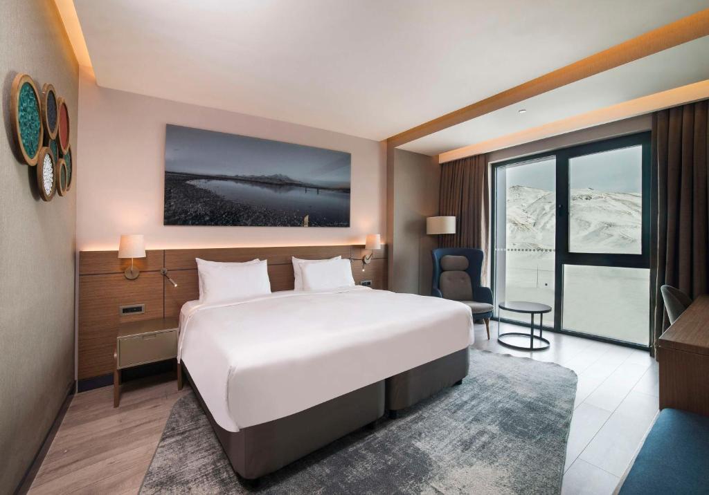Кровать или кровати в номере Radisson Blu Hotel, Mount Erciyes