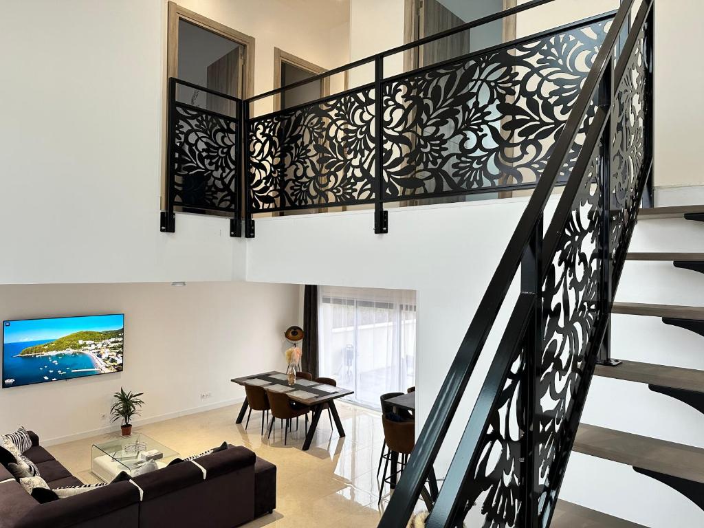 Posedenie v ubytovaní Loft l'escale Gîte Les Camélias 71