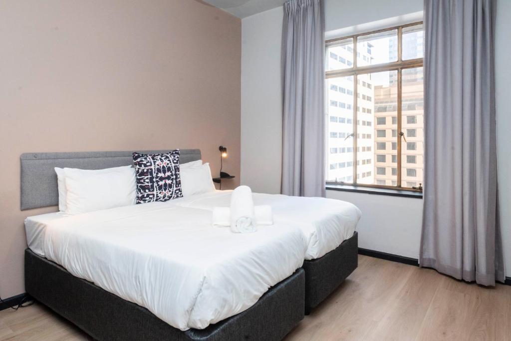 Postel nebo postele na pokoji v ubytování HAVN Aparthotel by Totalstay