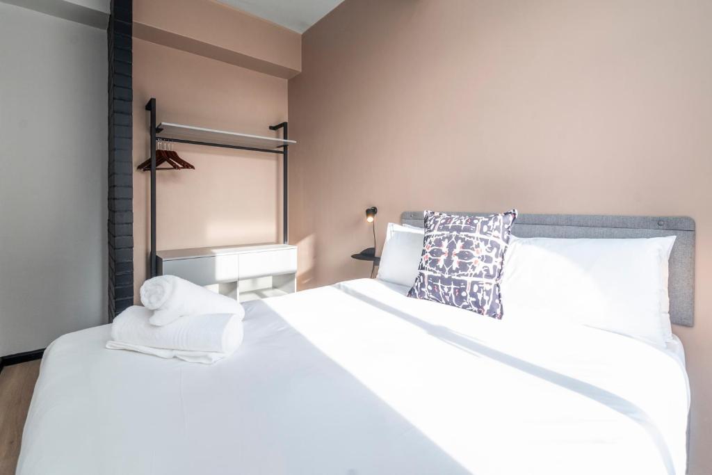 Postel nebo postele na pokoji v ubytování HAVN Aparthotel by Totalstay