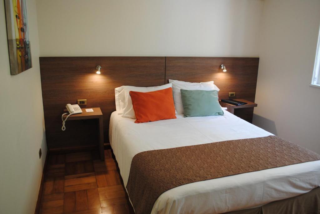 Postel nebo postele na pokoji v ubytování Hotel Santa Lucia