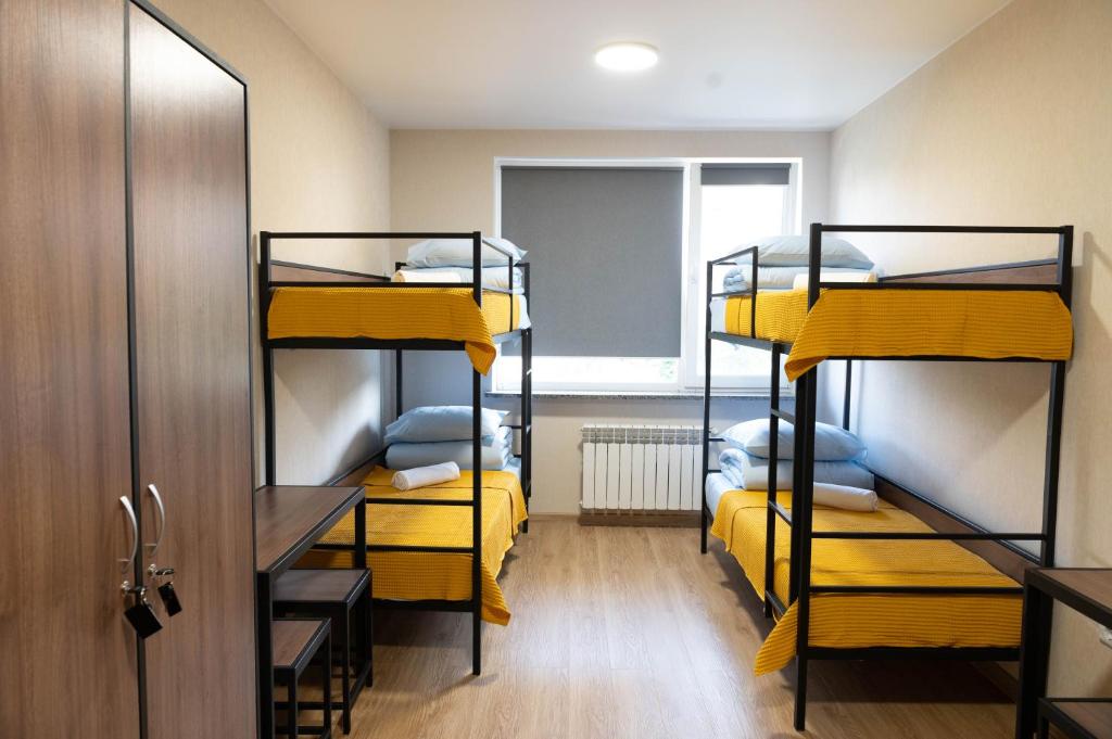 Postel nebo postele na pokoji v ubytování Hostel H