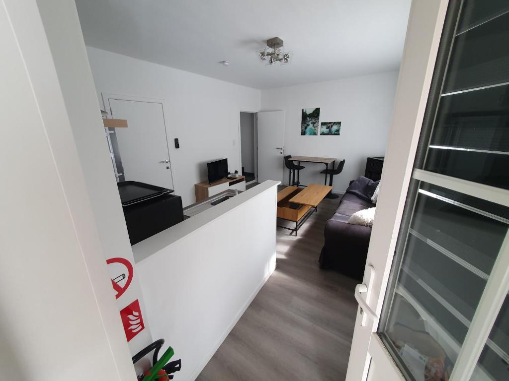 a view of a living room from the hallway of a apartment at Douce Mathilde in Aywaille