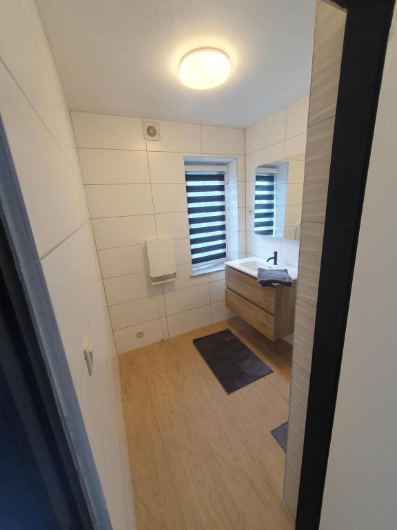 an overhead view of a bathroom with a sink at Douce Mathilde in Aywaille