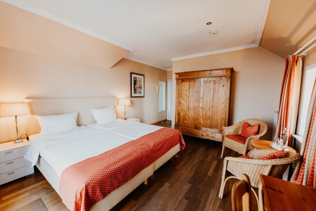 Postel nebo postele na pokoji v ubytování Hotel Hüttmann