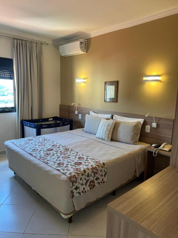 Cama ou camas em um quarto em Guararema Parque Hotel