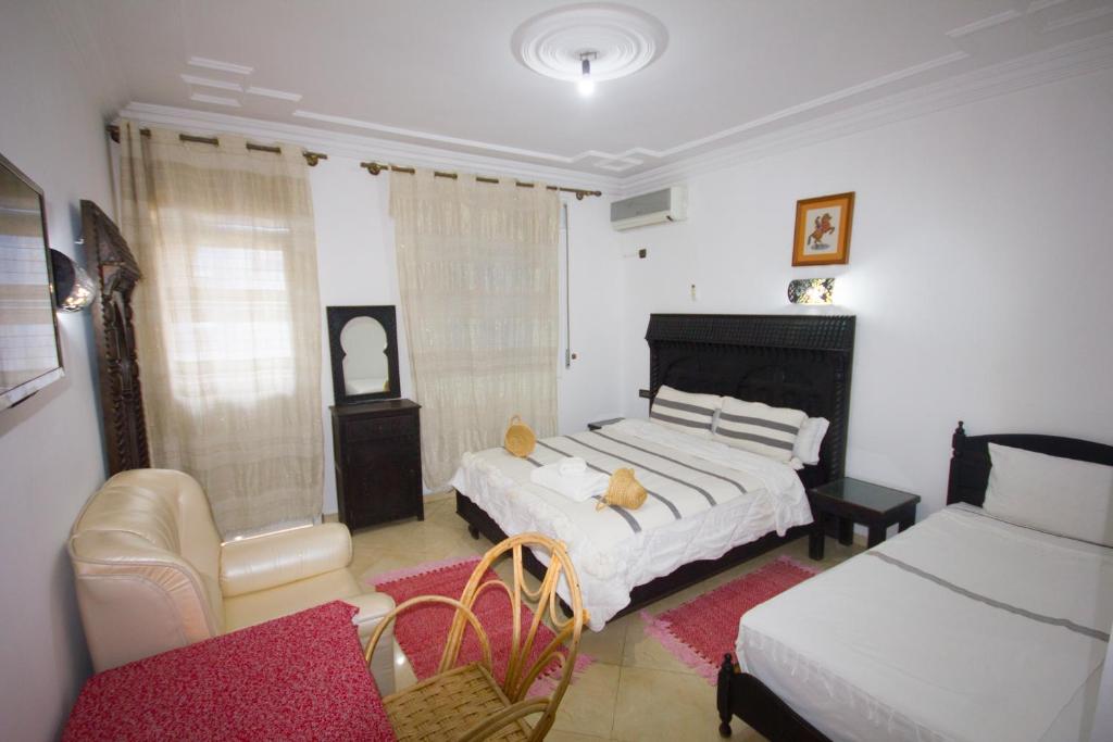 Postel nebo postele na pokoji v ubytování Hotel Meftah Chaouen