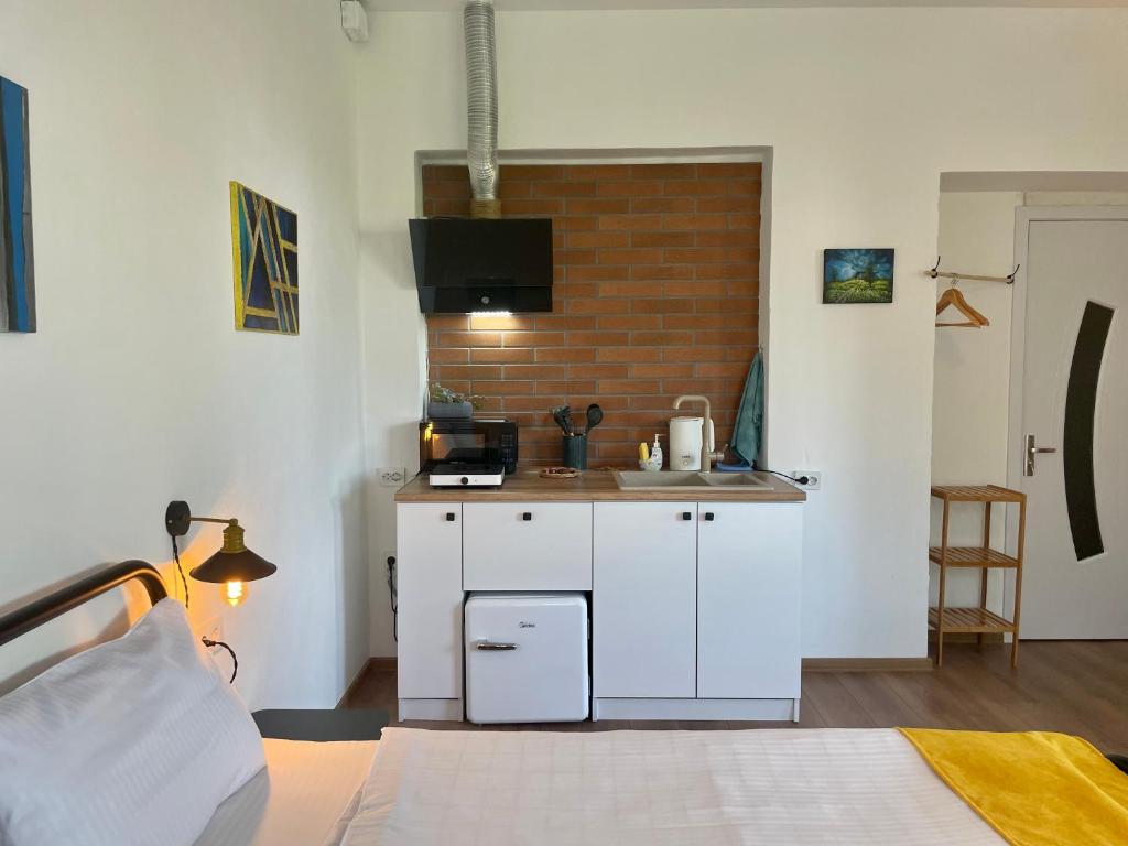 Kuchyň nebo kuchyňský kout v ubytování Friendly Home