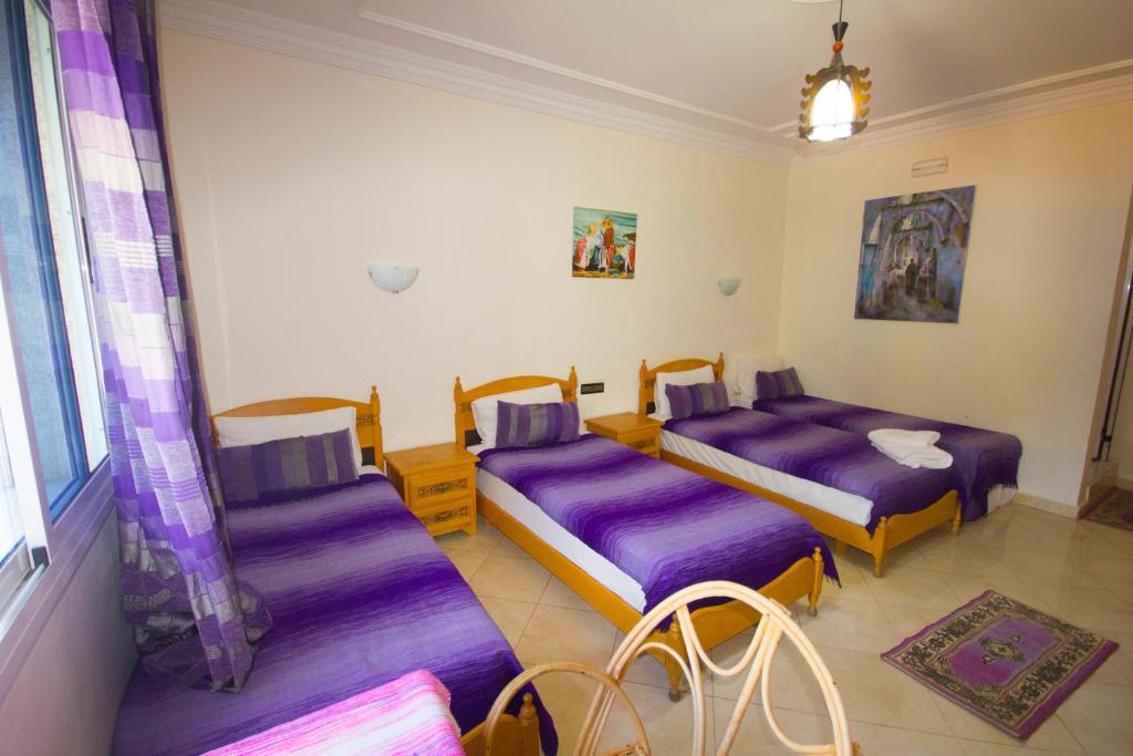 Postel nebo postele na pokoji v ubytování Hotel Meftah Chaouen