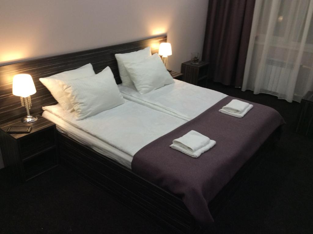 Кровать или кровати в номере Отель Любимый Город