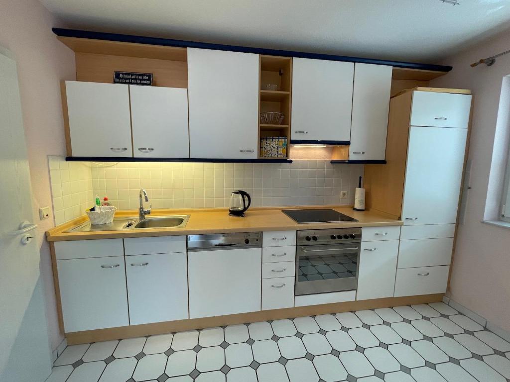 Kuchyň nebo kuchyňský kout v ubytování Ferienwohnung FlatNETT