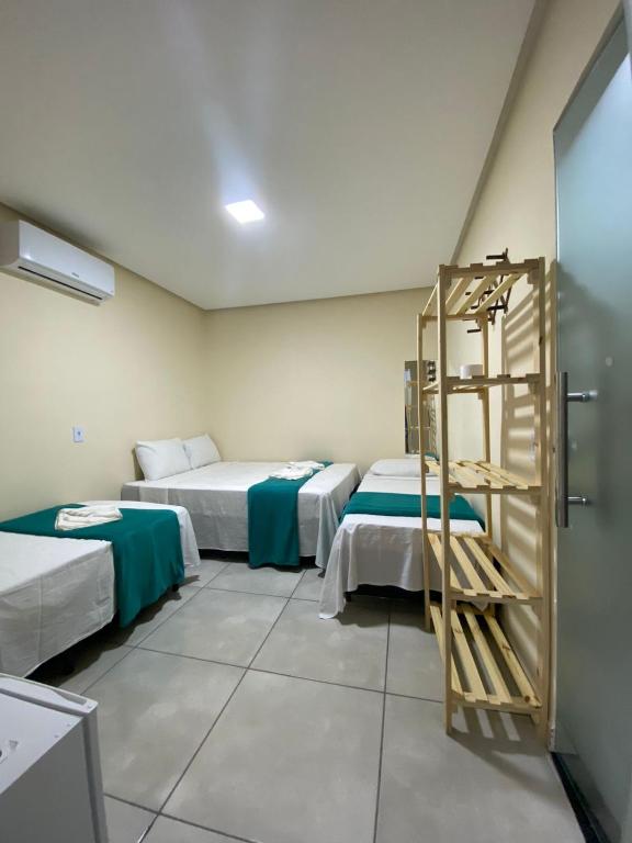Cama ou camas em um quarto em Pousada Vista da Serra - Suzart