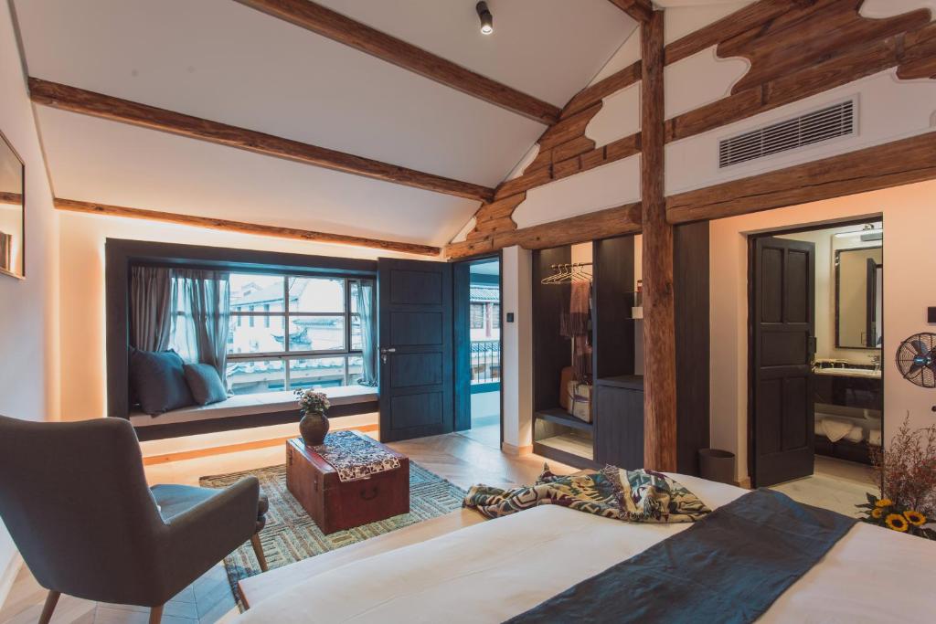Postel nebo postele na pokoji v ubytování Infini House