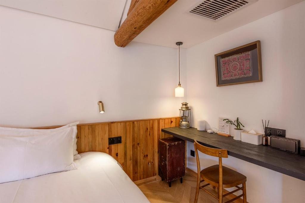 Postel nebo postele na pokoji v ubytování Infini House