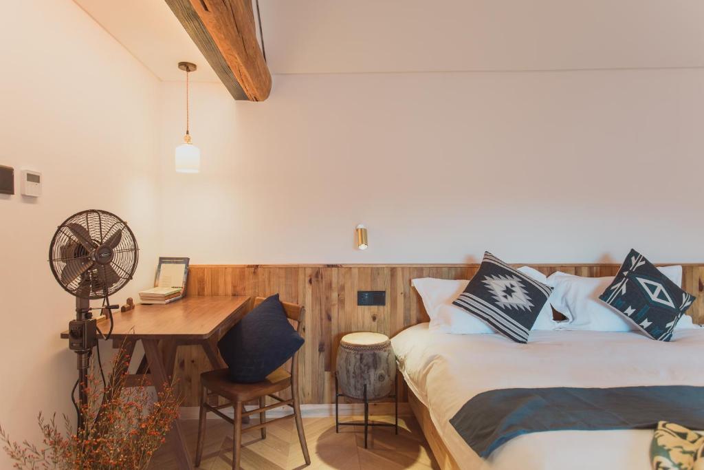 Postel nebo postele na pokoji v ubytování Infini House