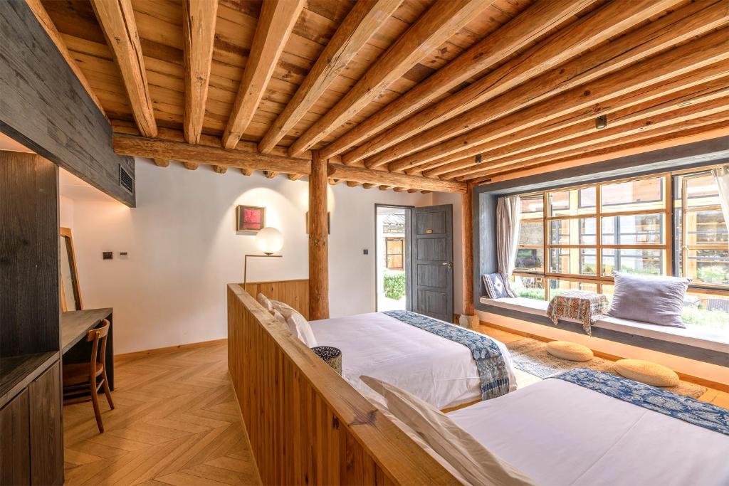 Postel nebo postele na pokoji v ubytování Infini House