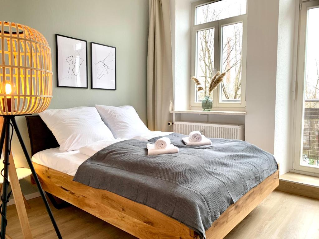 a bedroom with a bed with two towels on it at Cozy one bedroom apartment in Augsburg in Augsburg