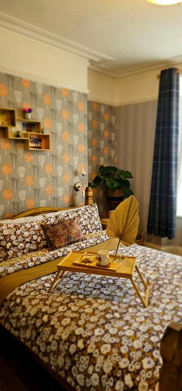 a room with a bed with a table on it at Home away from home in Aberdeen