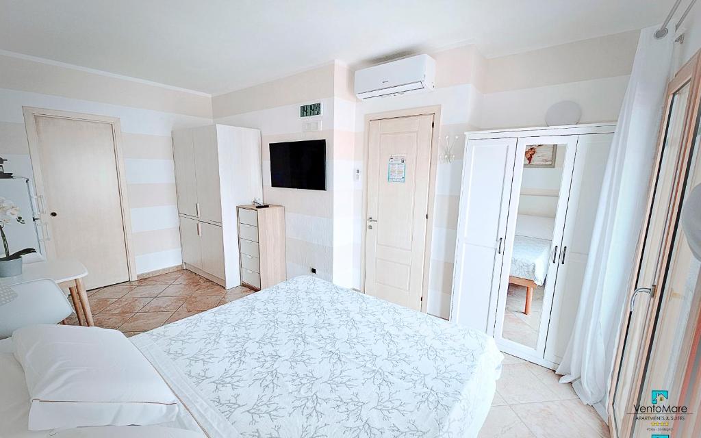 Postel nebo postele na pokoji v ubytování Apartments & Suites Vento Mare