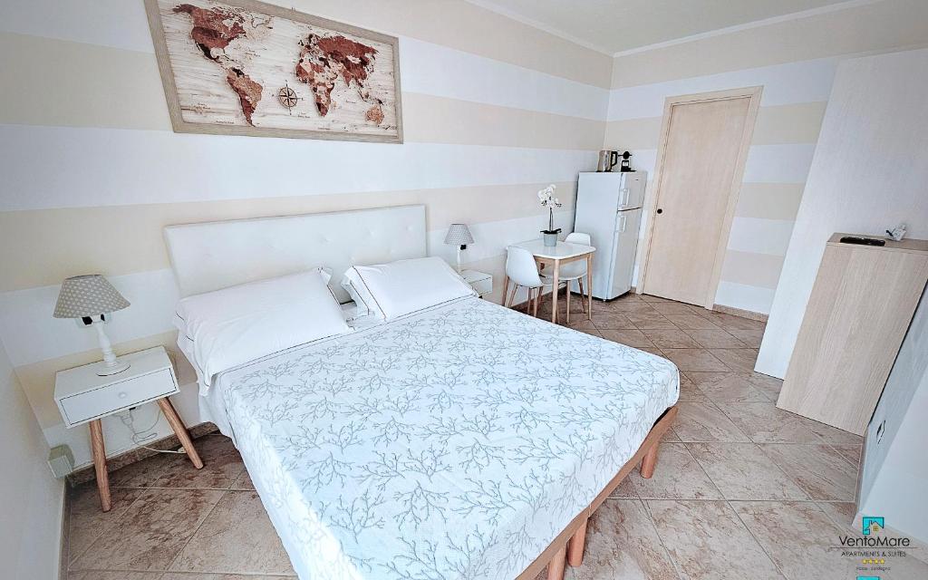 Postel nebo postele na pokoji v ubytování Apartments & Suites Vento Mare