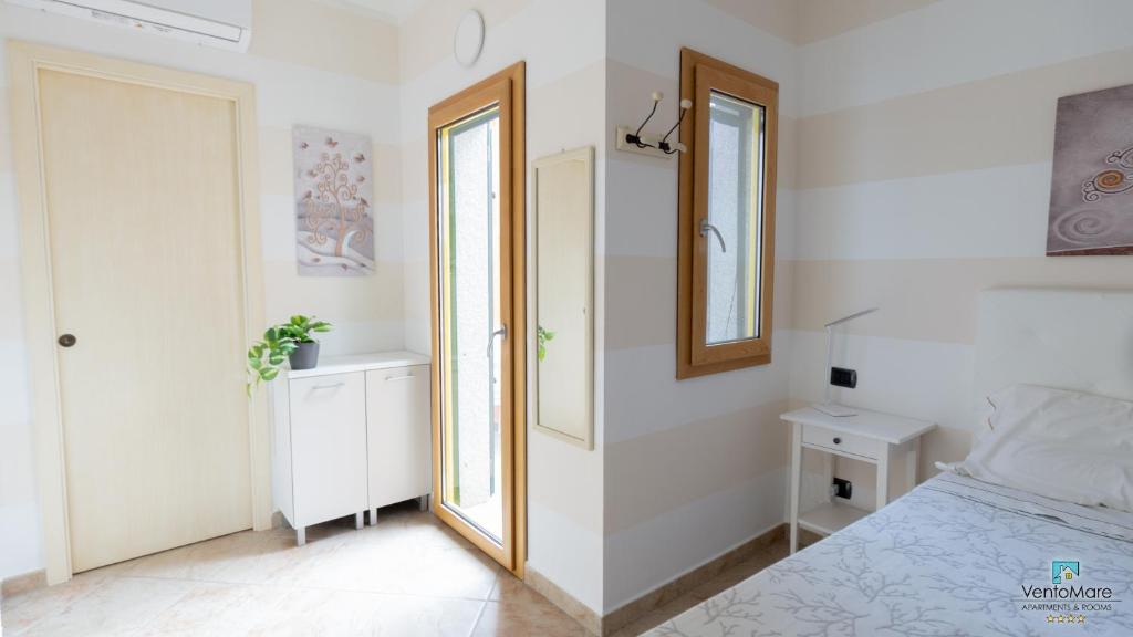 Postel nebo postele na pokoji v ubytování Apartments & Suites Vento Mare