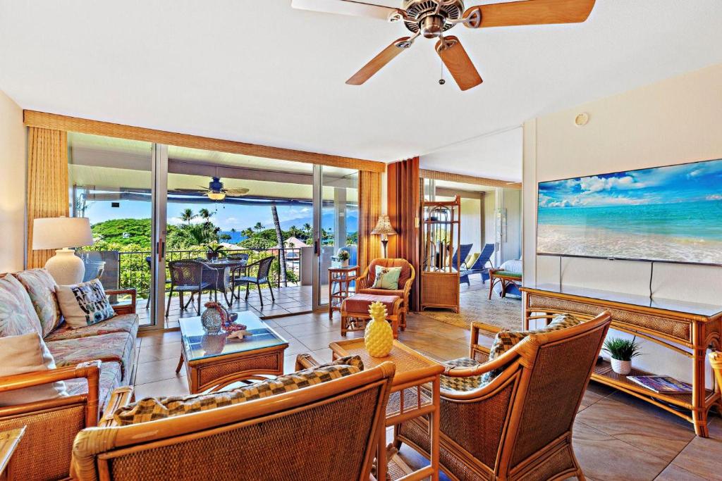 a living room with a couch and a table at Maui Eldorado Condo F203 in Kaanapali