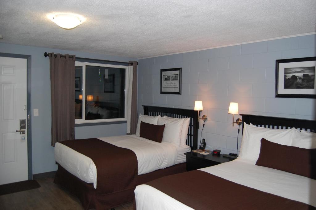 Postel nebo postele na pokoji v ubytování Rest Inn