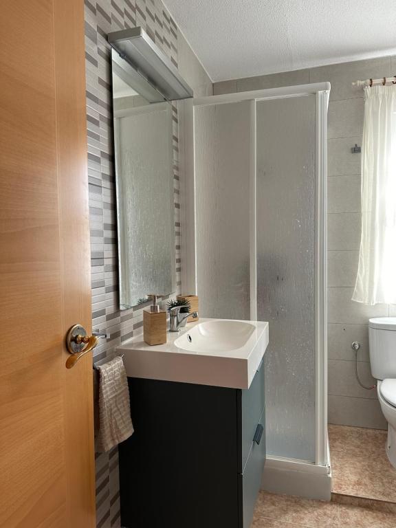 a bathroom with a sink and a toilet at Blue Home in Los Alcázares
