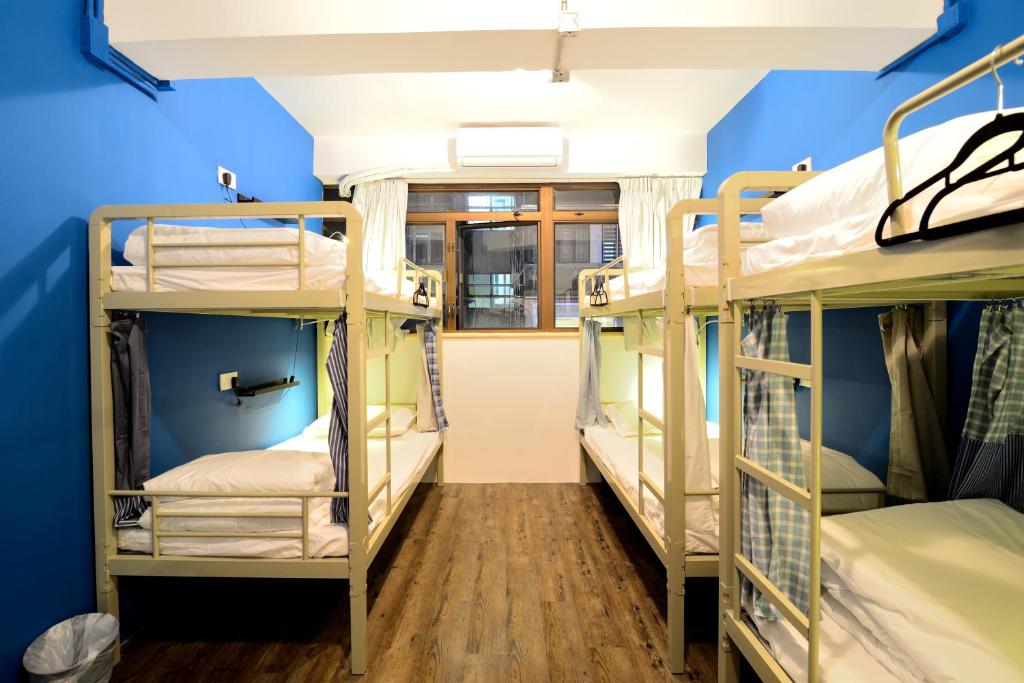 Letto o letti in una camera di Hop Inn