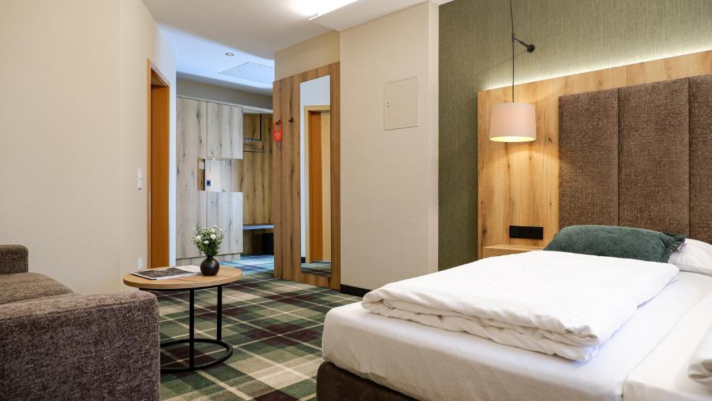 Postel nebo postele na pokoji v ubytování Hotel Restaurant Erber