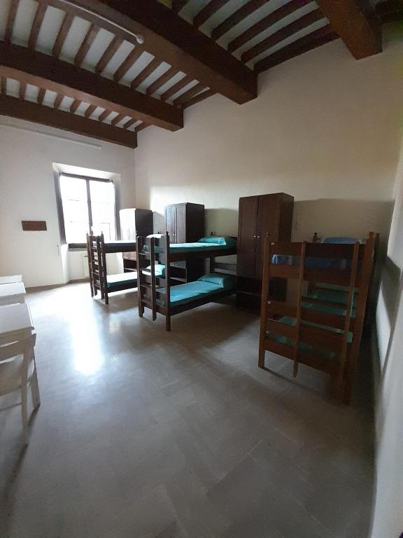 Postel nebo postele na pokoji v ubytování Ostello San Marco Cortona