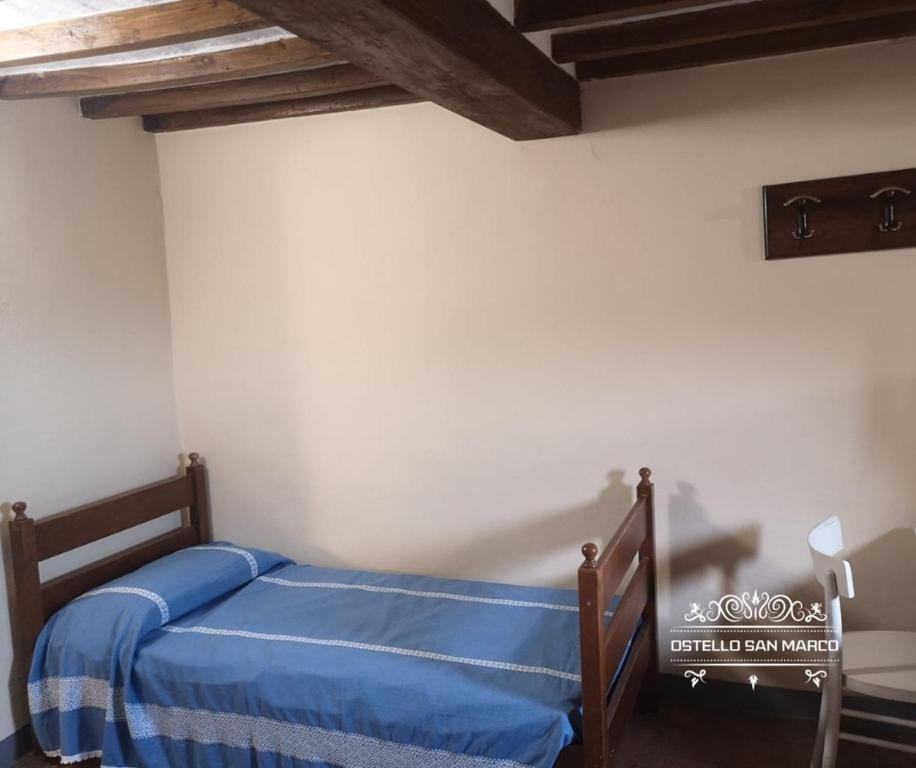 Postel nebo postele na pokoji v ubytování Ostello San Marco Cortona