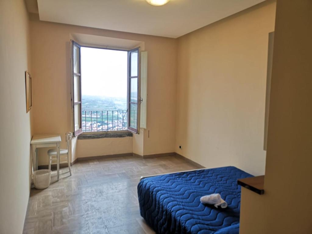 Postel nebo postele na pokoji v ubytování Ostello San Marco Cortona