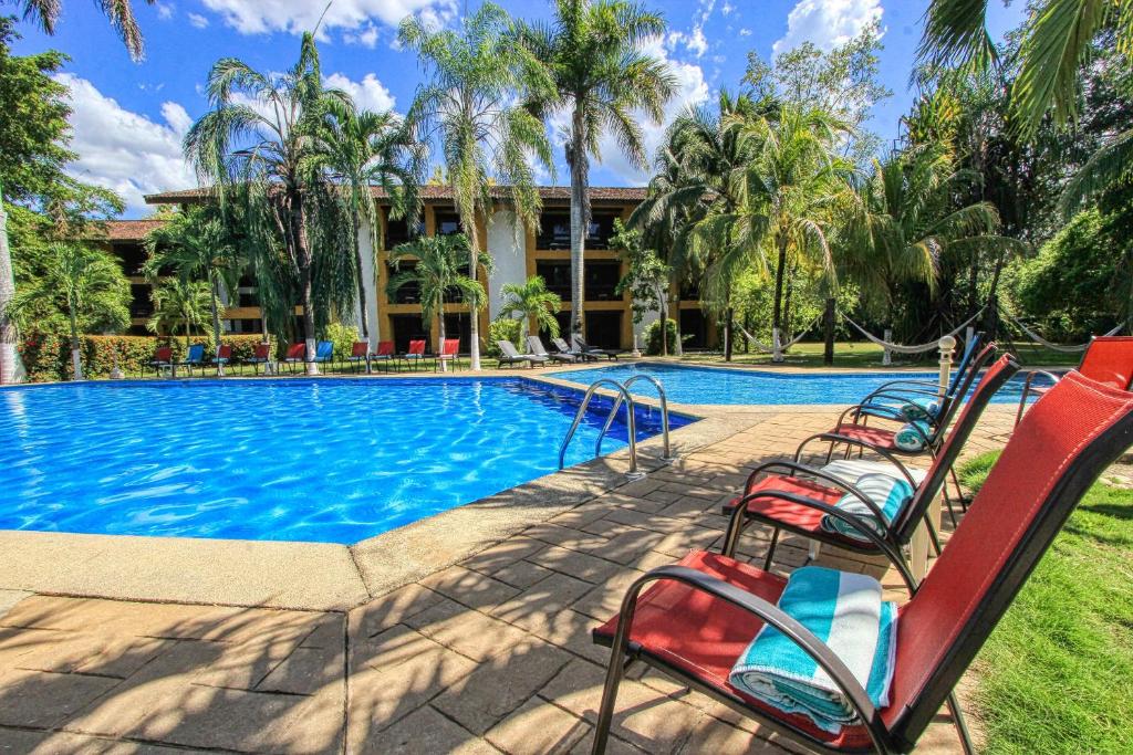 Bazén v ubytování Hotel Ciudad Real Palenque nebo v jeho okolí