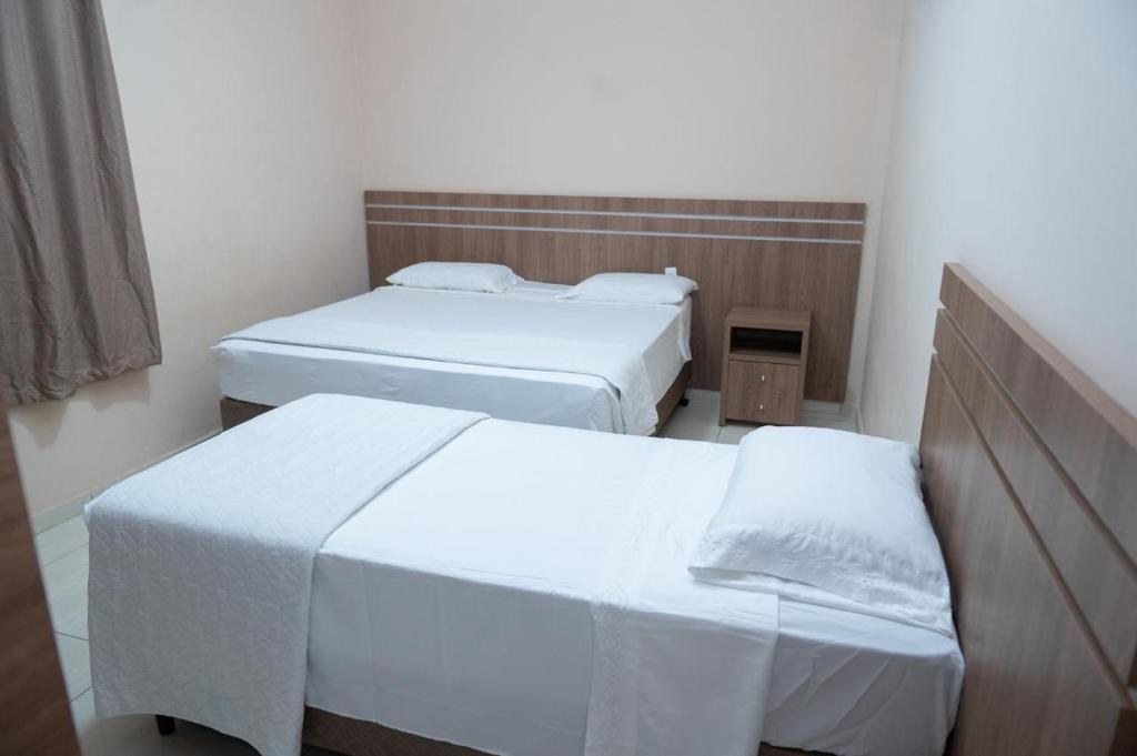 Postel nebo postele na pokoji v ubytování Hotel Alibertti
