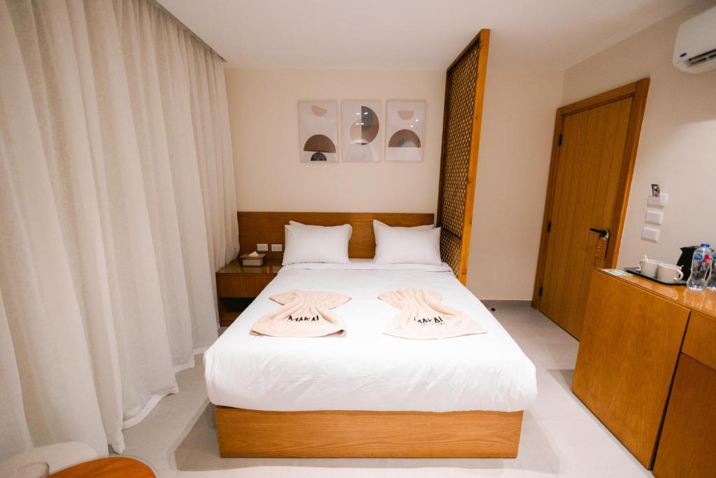 Rúm í herbergi á Makai Pyramids Guest House
