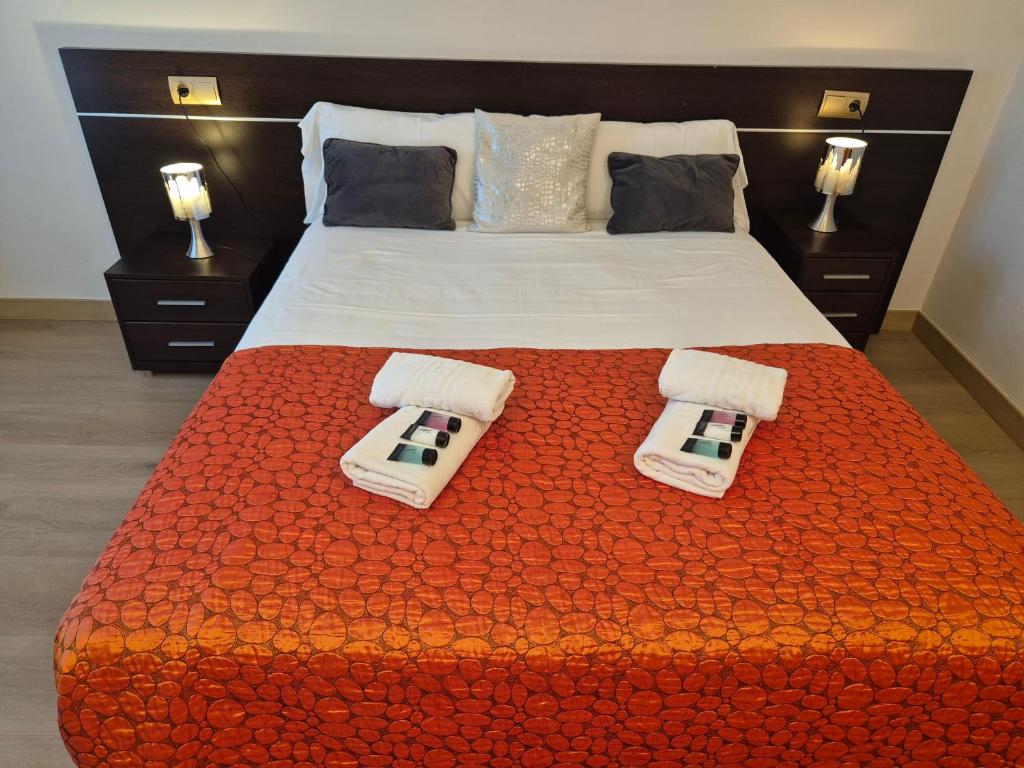 Posteľ alebo postele v izbe v ubytovaní Hostal Bavieca