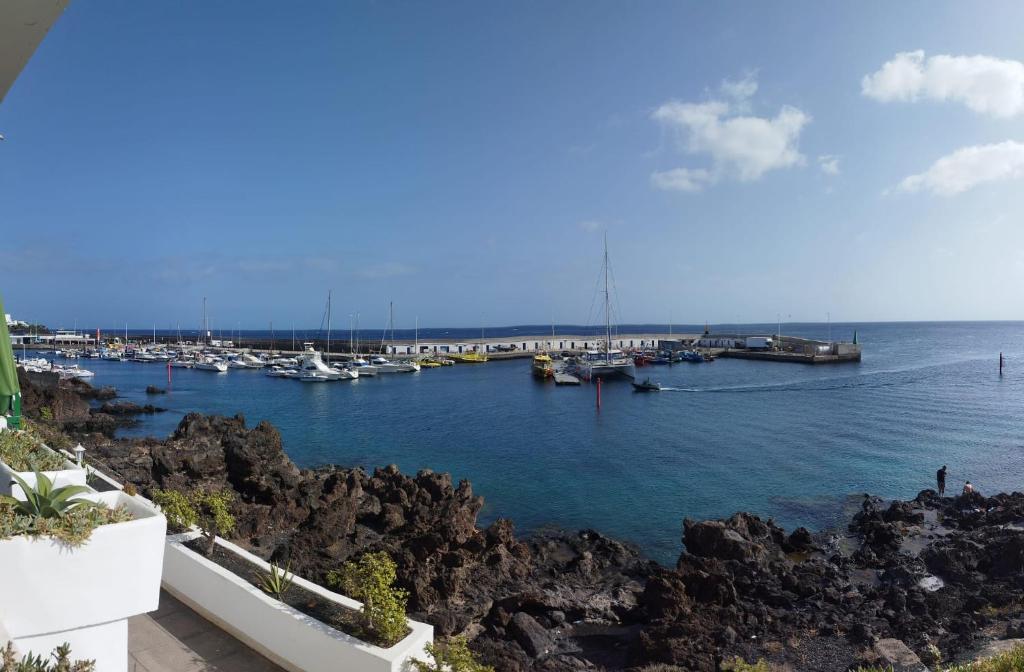 a view of a marina with boats in the water at Buena pesca 7 in Puerto del Carmen