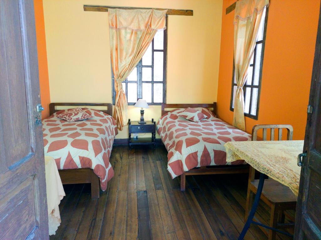 Postel nebo postele na pokoji v ubytování La Posada Colonial