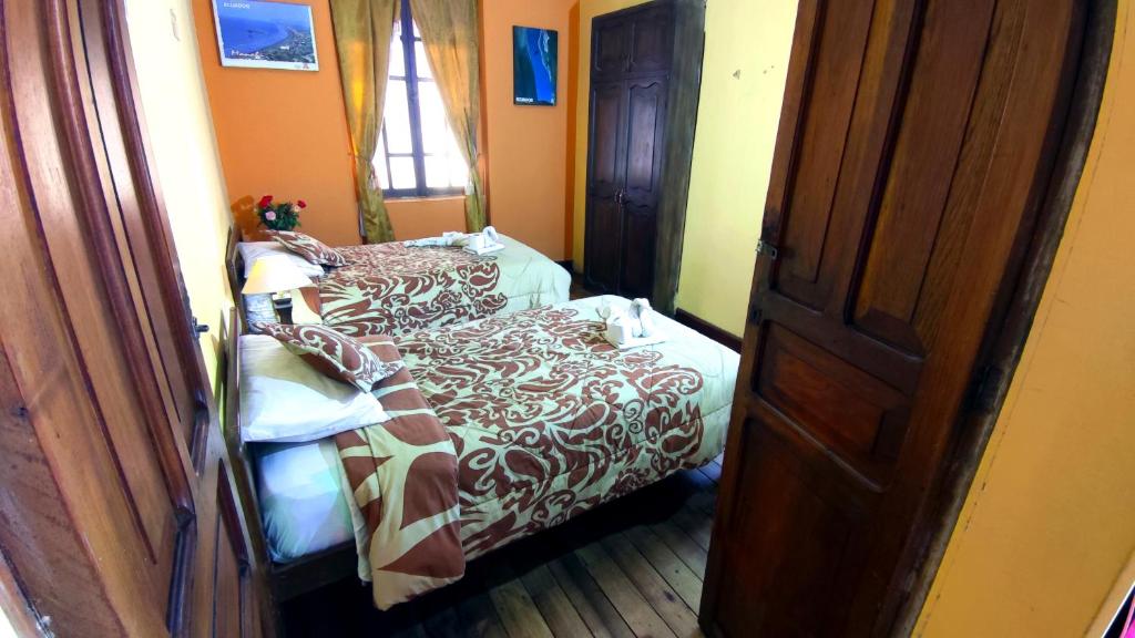 Postel nebo postele na pokoji v ubytování La Posada Colonial